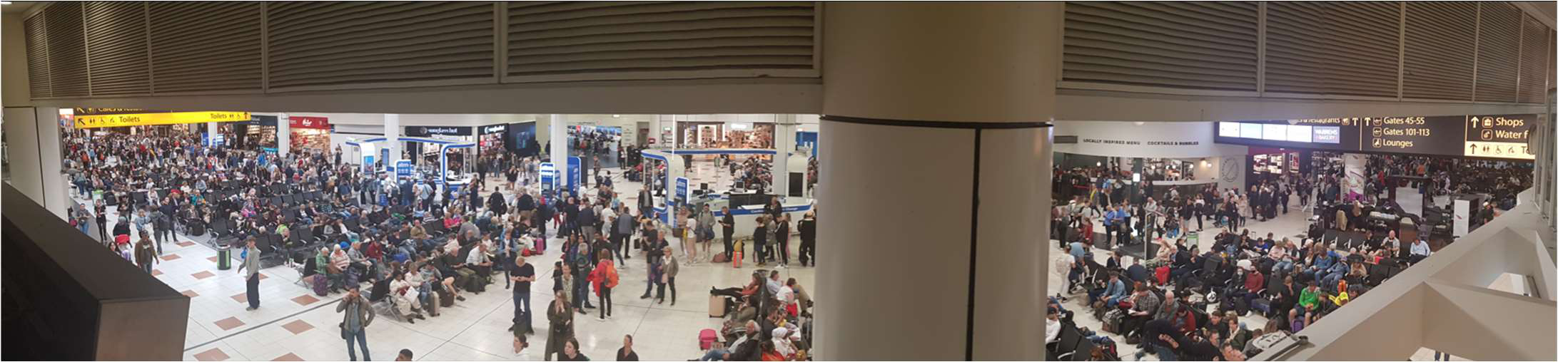 Photograph of a crowded airport terminal